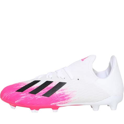 white and pink adidas boots.